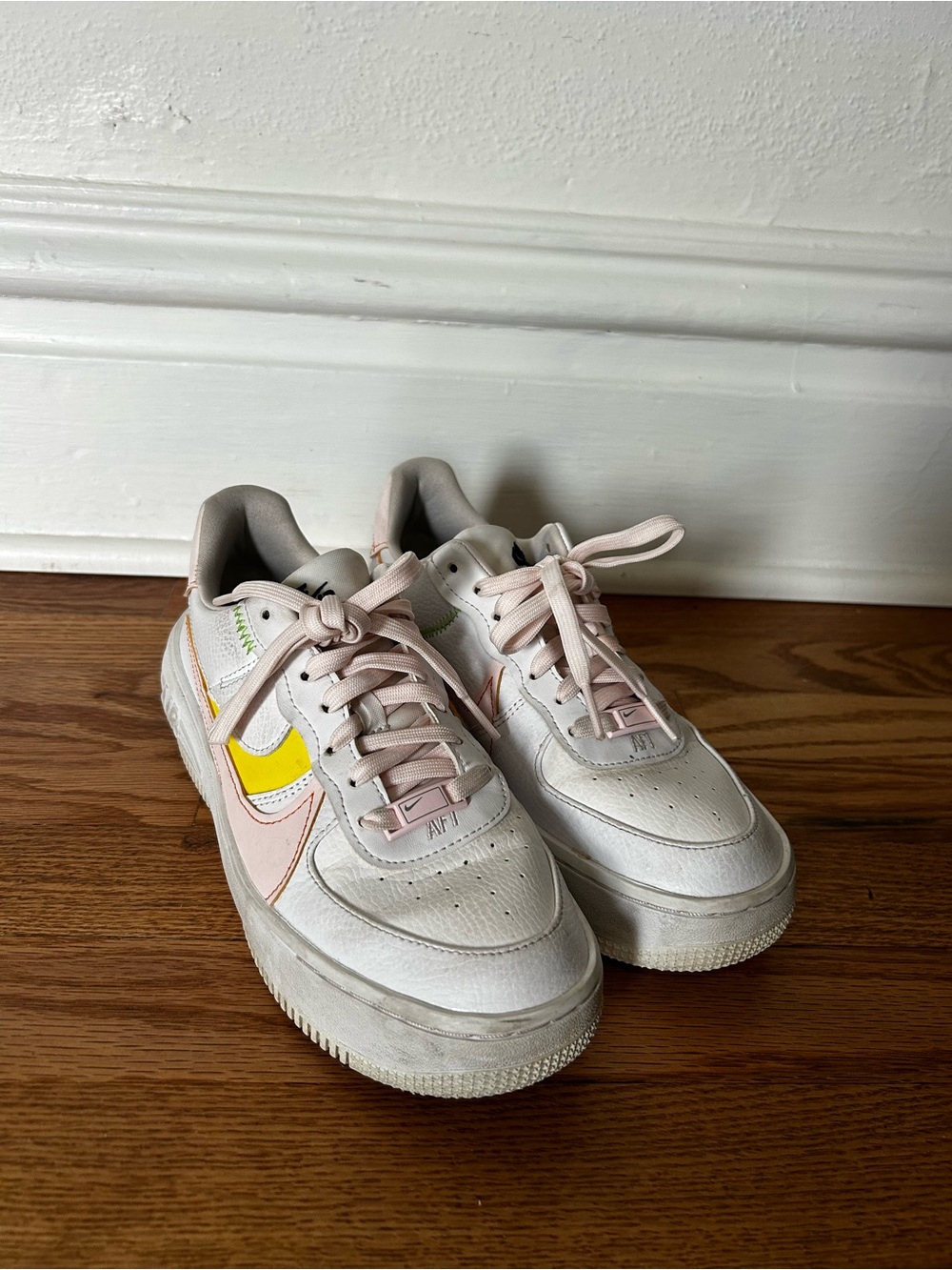 Nike Low-Top Sneakers in White with Yellow & Light Pink Accents